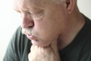 Man Holding Throat | Missouri Nexium Lawsuit