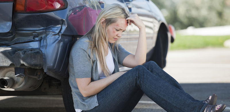 Woman Next to Car | Nevada Auto Accident Lawyer