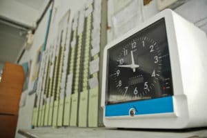 Clocking in machine | Virginia Unpaid Overtime Lawsuit