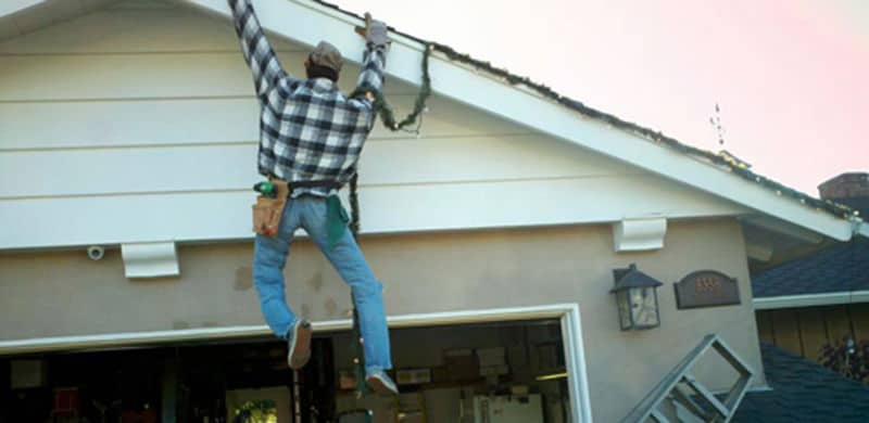 Man Hanging From His Roof | common holiday accidents