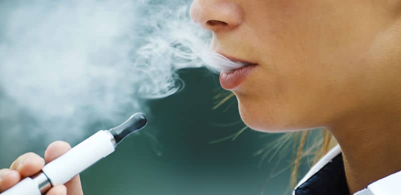 Person Smoking An E-Cig | E Liquids Lawsuit