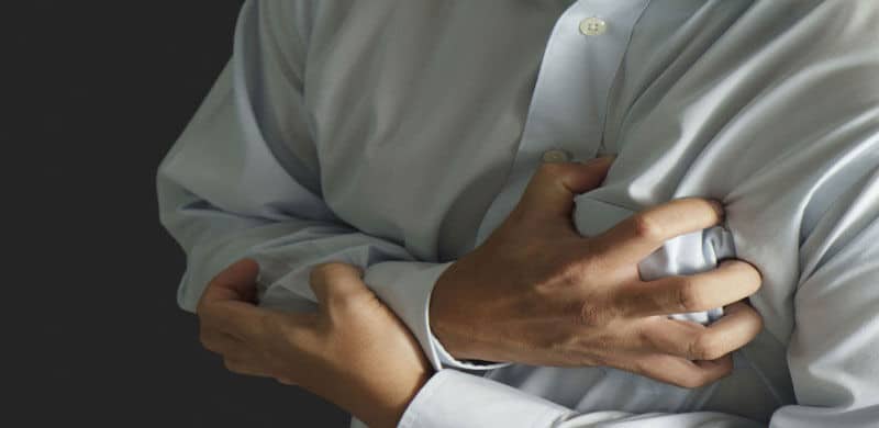 Man holding his heart | Imodium Side Effects Lawyer