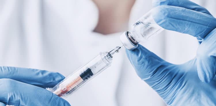Doctor Drawing Vaccine from Vial – Rotavirus Vaccine Antitrust Lawsuit