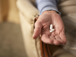 Person Holding Two Pills | Florida Benicar Lawsuit